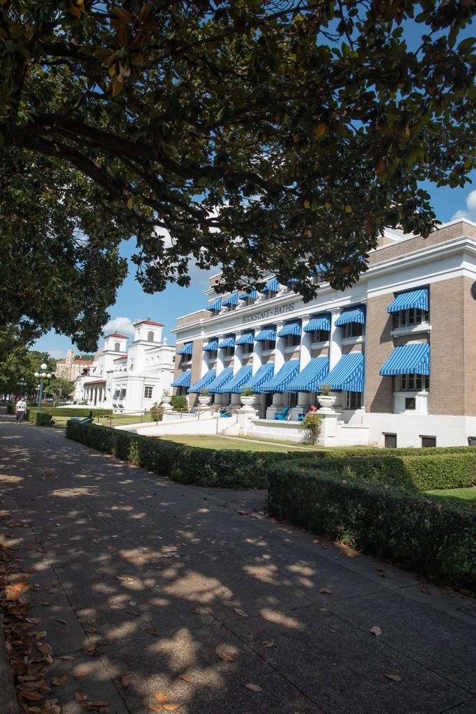 Exterior of the buckstaff baths with the distinctive blue and white striped awnings.