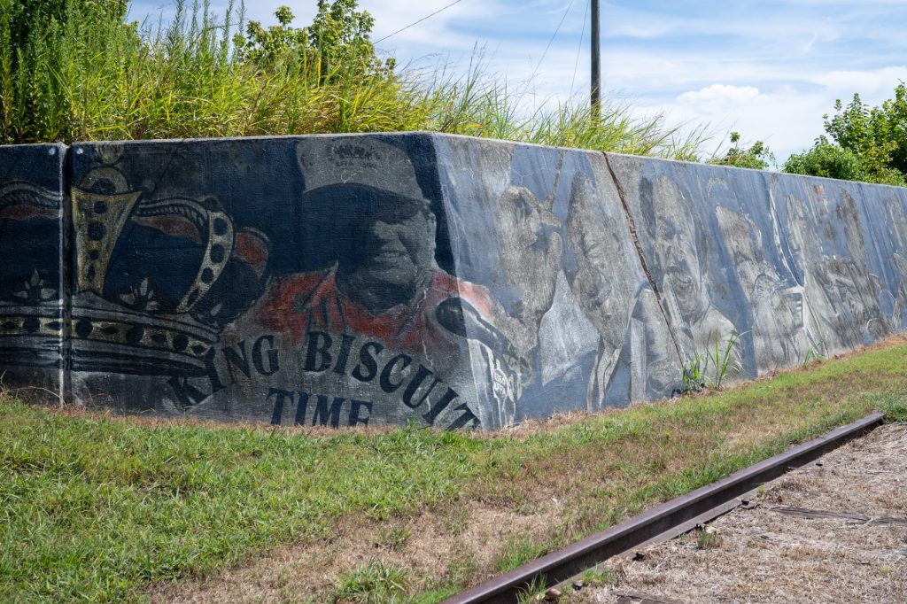 A wall with paintings of famous blues musicians from the King Biscuit Time radio show. 
