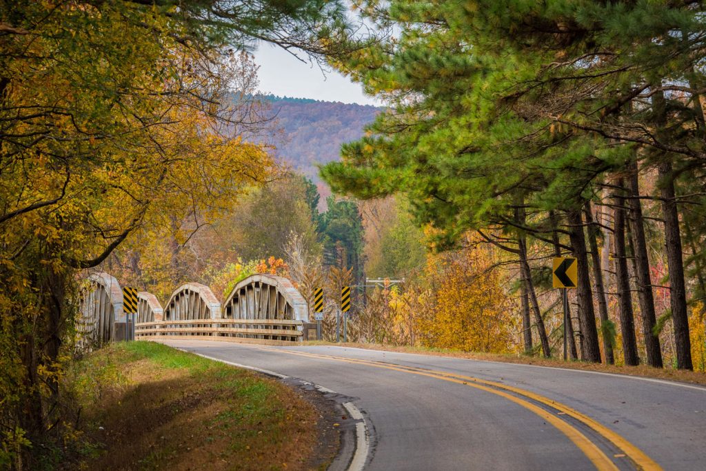 A winding road in Arkansas in the Ozark Mountains in the fall.