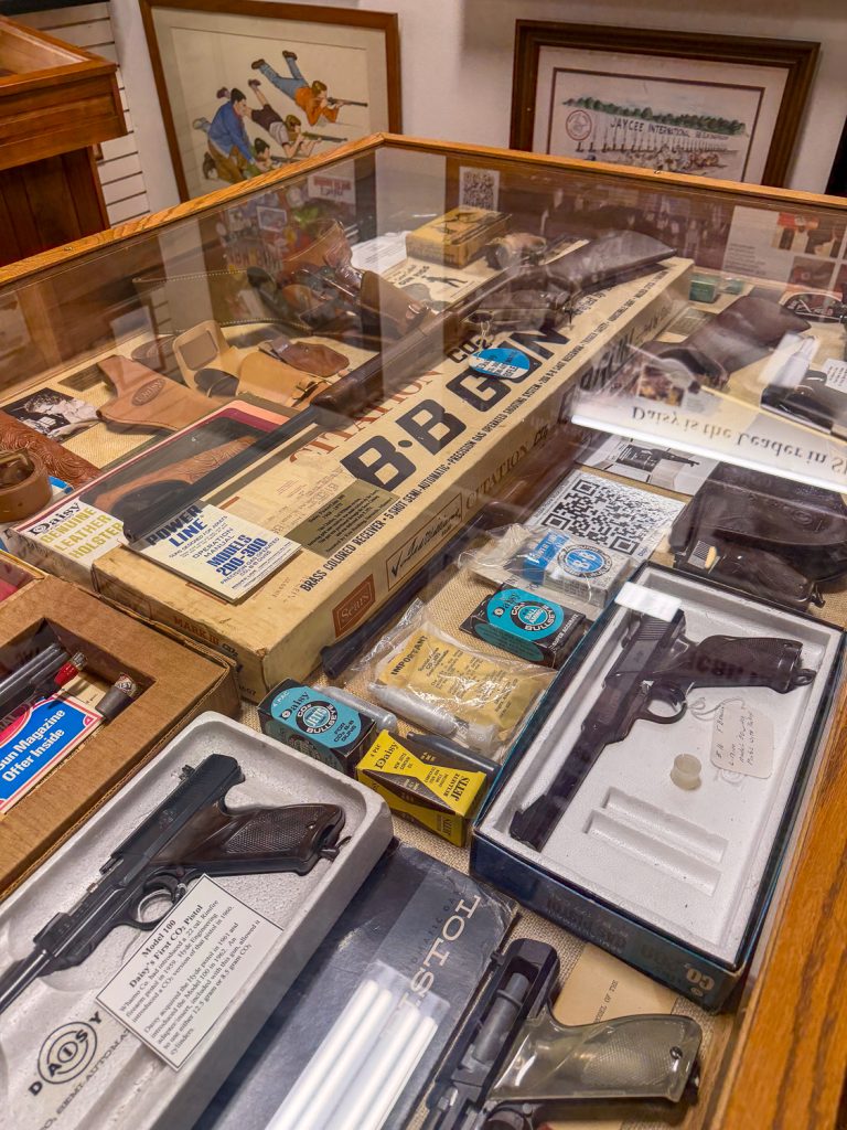 historic air guns in a case
